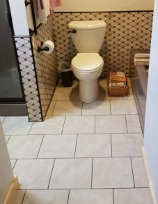 tiling on bathroom floor and half wall