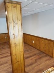 half wall wooden paneling in basement