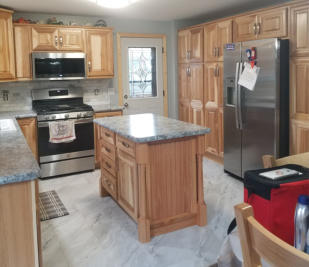 kitchen with new wood island and granite countertop