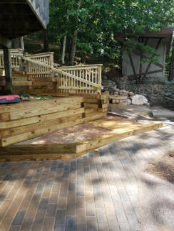 stone pavers patio with wooden steps